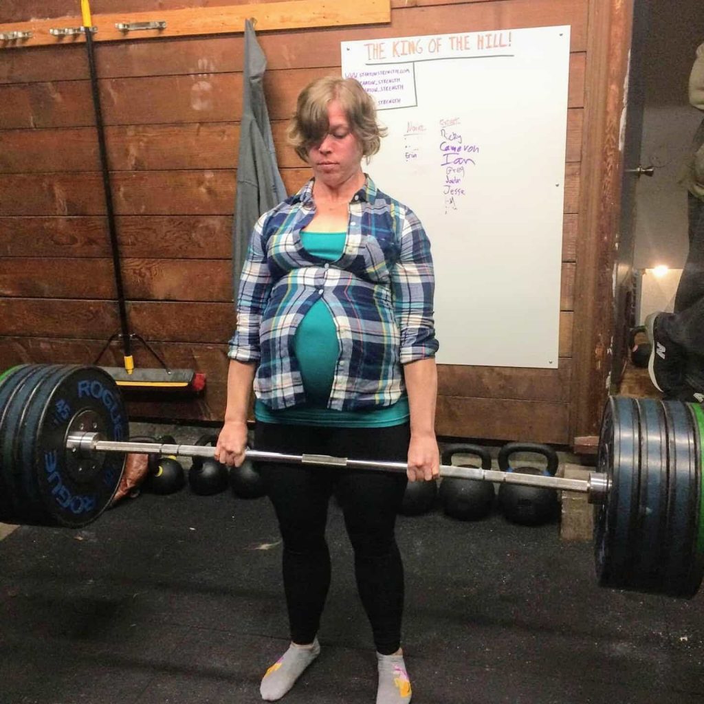 Pregnant powerlifter deadlifting